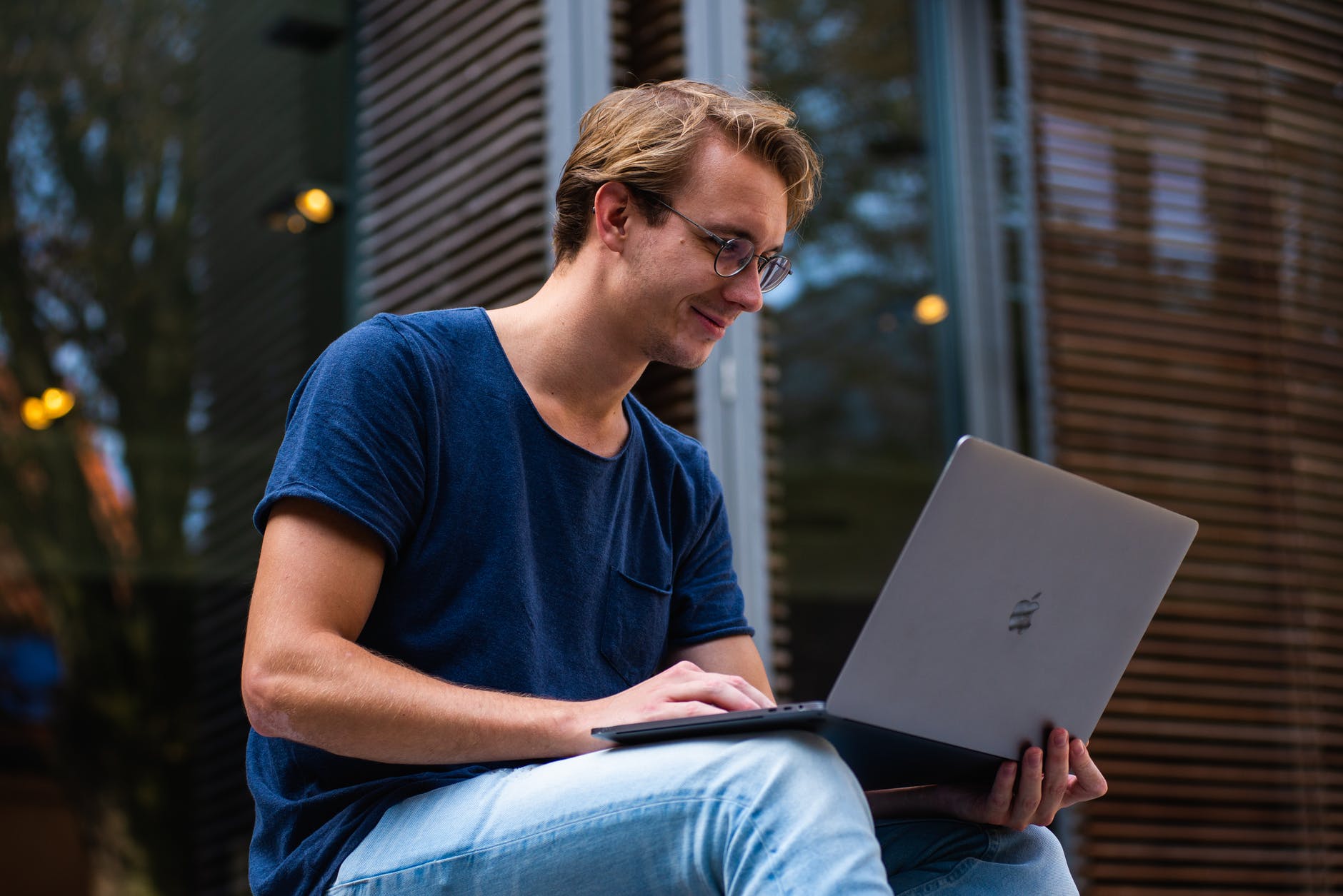 selective focus photo of man using laptop